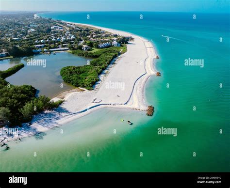 An Aerial View Of Longboat Key Town Surrounded By Buildings And Water