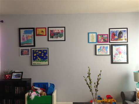 Living Room Wall Where The Kids Art Is Framed And Displayed