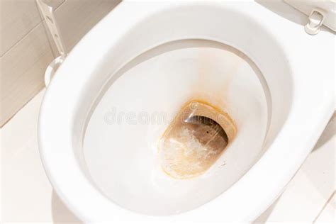 Dirty Unhygienic Toilet Bowl With Limescale Stain At Public Restroom