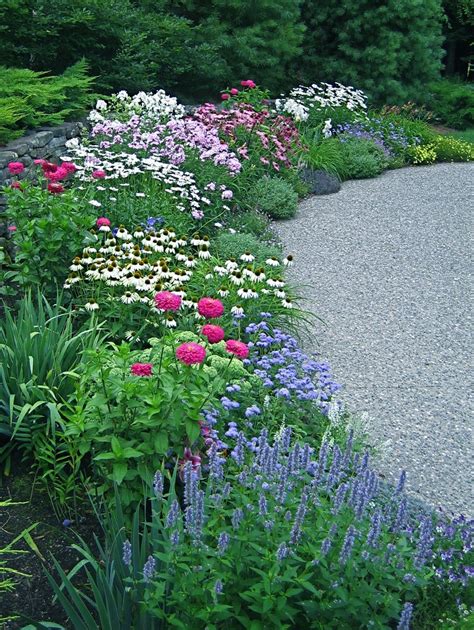 By planting different perennial flowers and shrubs with an eye on early, mid, and late growing seasons fortunately, there are many varieties within a perennial family that have different bloom periods, allowing your favorite flowers to have a long presence in your garden for a good part of the. Great Perennial Border | Garden, Beautiful gardens, Garden ...