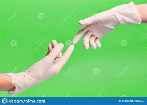 Two Gloved Hands Touch Each Other During Quarantineprotected Sex