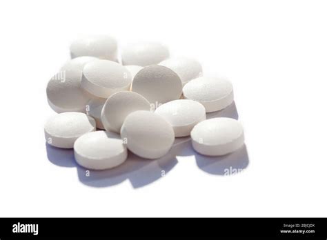 Many Generic Small Round White Pills Lots Of Little Tablets On White