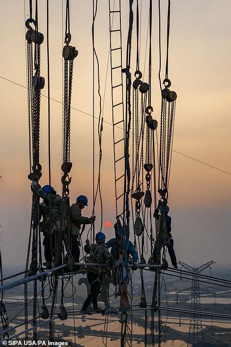 Electrifying Chinese Power Line Workers Dangle 300ft In The Air As
