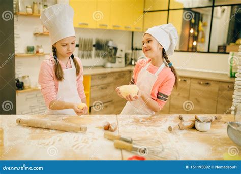 Little Chefs Roll Out The Dough With Rolling Pins Stock Photo Image