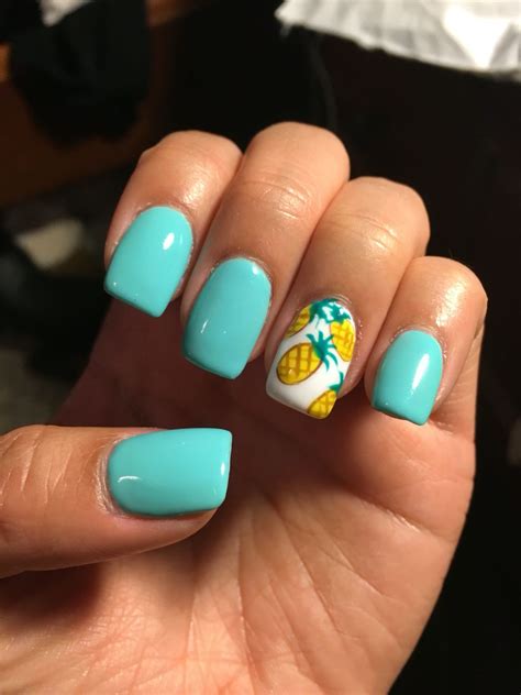 The cute nail idea will make your hands more refined and that will give your image of lightness and grace. Summer nails! Teal acrylics with pineapples | Beach nail ...
