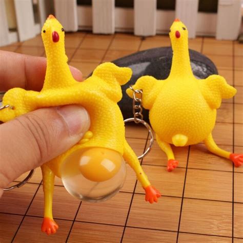 two pics of rubber chicken laying egg squeezing stress relief keychain toys ebay