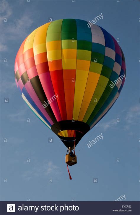 Colorful Hot Air Balloon Launching Against A Blue Sky