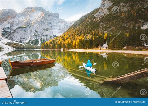 Young Man In Kayak At Lago Di Braies In Fall Dolomites Italy Stock