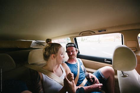Couple On Backseat Of A Car By Stocksy Contributor Urs Siedentop And Co Stocksy