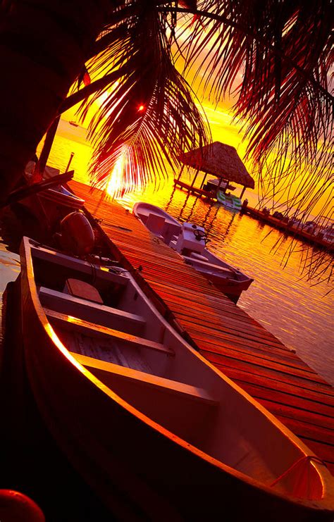 Skiff In The Sunset Caye Caulker Belize Photograph By Lee Vanderwalker