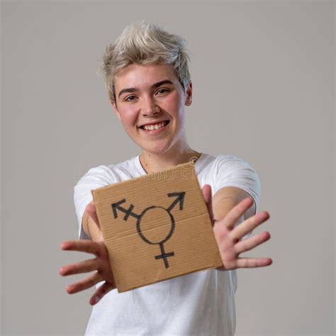 Portrait Of Happy Proud And Confident Trans Teenager Man Holding