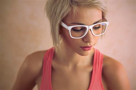 Beautiful Young Blond Girl With Short Hair Wearing Glasses