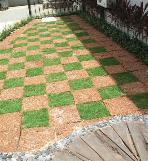 A concrete paver walkway with mexican pebble joints leads from the main house to the backyard art studio. Creative Garden Design - Grass and Brick Paver - Thai ...