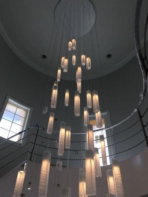 A foyer chandelier in a two story home should provide illumination but it's also an opportunity to make a statement since it one of the elements that sets the first impression of your home. Contemporary two story chandelier-by Galilee lighting ...