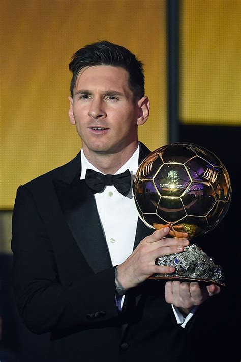 Fc Barcelona And Argentinas Forward Lionel Messi Poses With His Trophy
