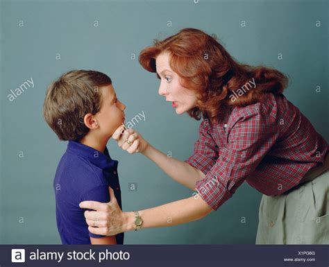 Mother Scolding Her Son Stock Photos And Mother Scolding Her Son Stock