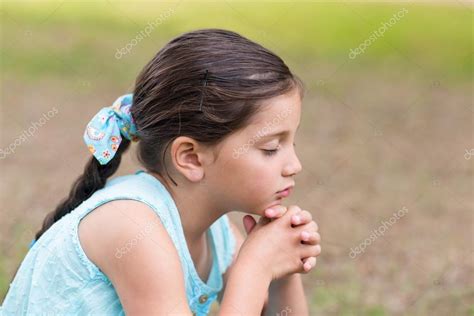 Little Girl Saying His Prayers — Stock Photo © Wavebreakmedia 76210947