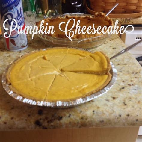 a pie sitting on top of a kitchen counter next to a can of pumpkin cheesecake
