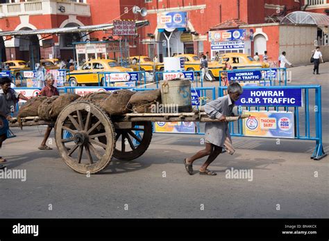 Man Pulling The Cart Near Howrah Railway Station Street Scene