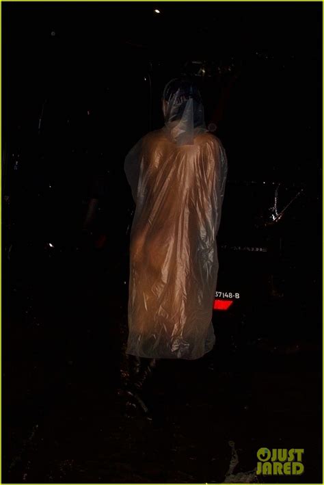 kanye west s wife bianca censori braves the rain in see through poncho with nothing underneath