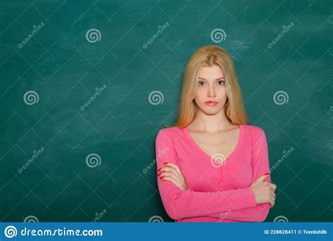 School Teacher In Class On Blackboard Background Professional Portrait