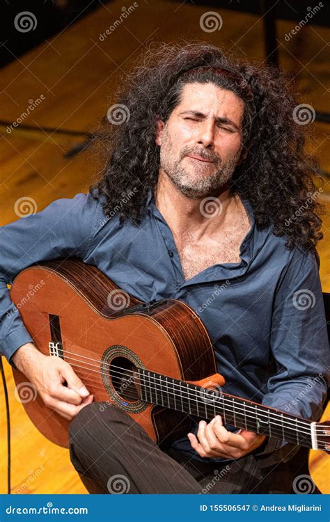 Handsome Man With Long Hair Playing Classical Guitar Editorial Photography Image Of Guitar