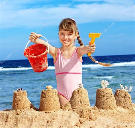 Child Playing On Beach — Stock Photo © Poznyakov 5972563