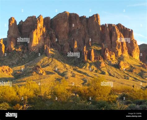 Superstition Mountain In Arizona At Sunset With Formation Called The