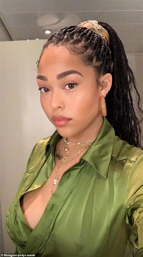 jordyn woods goes braless in plunging khaki dress as she steps out in lagos photos gidi
