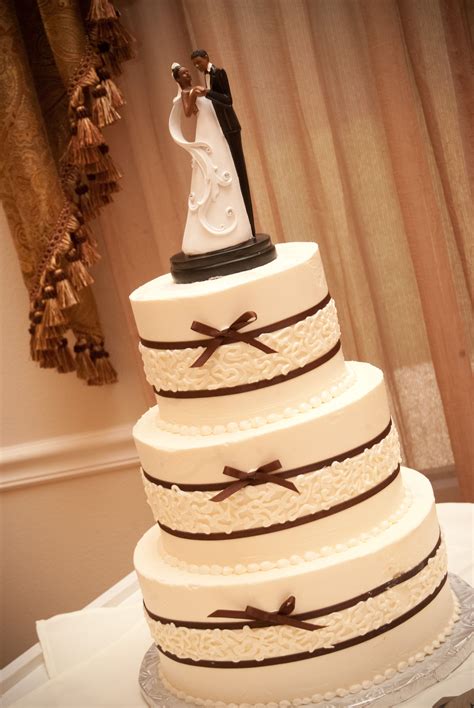 Beautiful And Simple Ivory Wedding Cake With Brown Ribbon Ivory