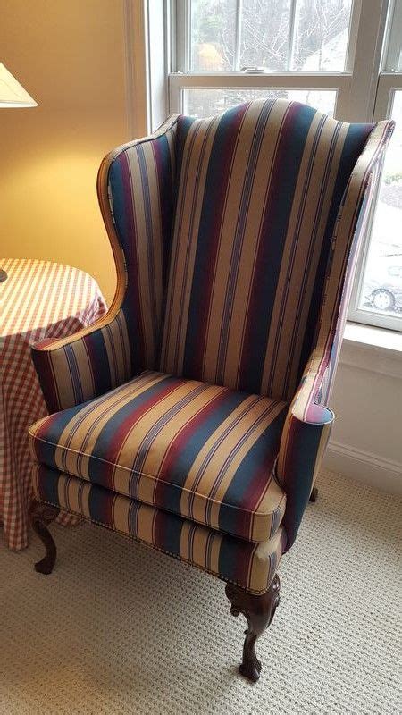 This armchair is the perfect addition to your home! Pair green, burgundy and tan striped wing chairs by ...