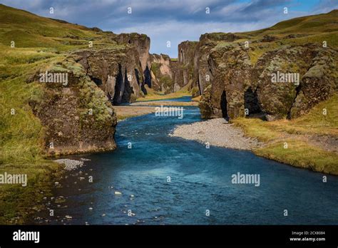 Beautiful Fjadrargljufur Canyon With River And Mossy Rocks In Iceland
