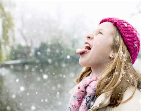 Girl In Snowfall Stock Photo