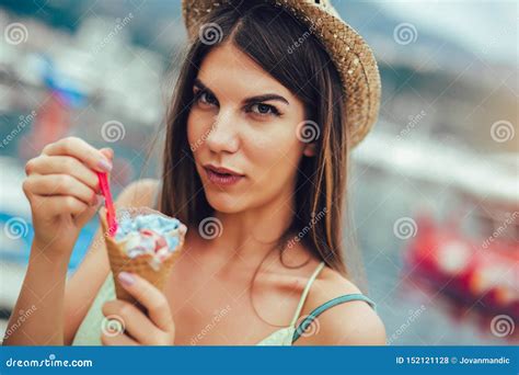 Woman Eating Ice Cream On Summer Vacation In Holiday Beach Resort Stock