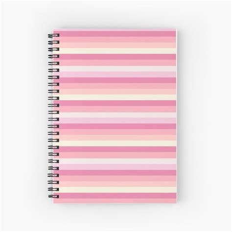 A Spiral Notebook With Pink And White Stripes On The Front In Pastel