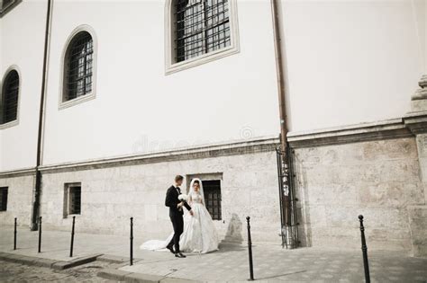 Wedding Photo Shooting Bride And Bridegroom Walking In The City Stock
