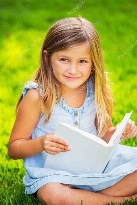 Little Girl Reading Book Outside Stock Photo By ©epicstockmedia 37459401