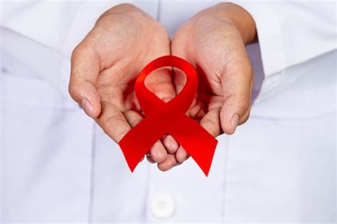 Free Photo The Doctor Holds A Red Ribbon Hiv Awareness Awareness World Aids Day And World