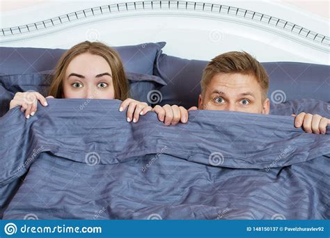 Adult Couple Hiding Under Blanket In Bed Couple In Bedroom In The Morning Stock Image Image