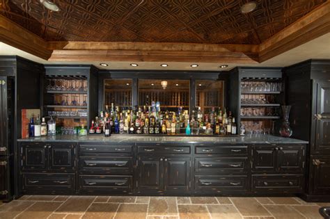 Usually, the bar is an extension of the kitchen island and is used to visually separate the kitchen from. Custom Built Home Basement Bar - Traditional - Home Bar ...