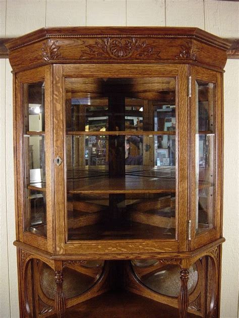Corner china cabinet (drcwcornera2) from chinas & buffets category is hand made by finest amish craftsmen specialized in mission and solid this stunning corner cabinet is proudly made in the united states. Antique Oak Tall Corner China Cabinet with Beveled Glass ...