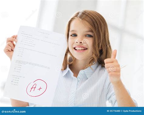 Smiling Little Student Girl With Test And A Grade Stock Photo Image