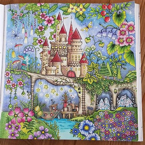 A Book With An Image Of A Castle And Flowers On The Cover Sitting On A