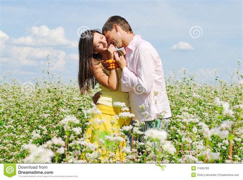 Young Couple On Field Of Flowers Stock Image Image Of Relaxation