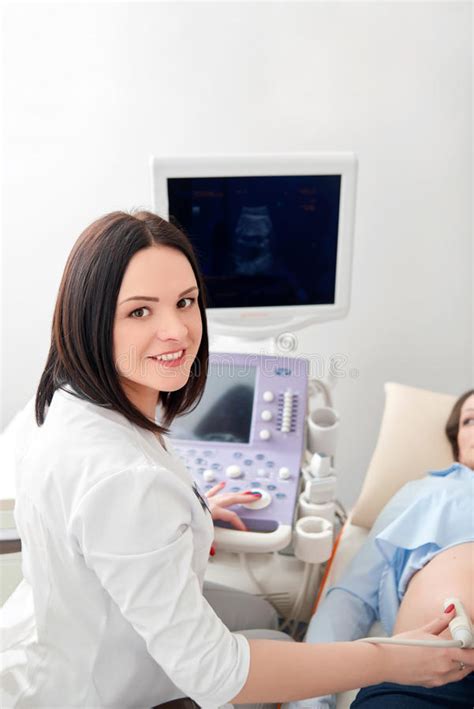 Doctor Using Ultrasound Pregnant Woman Press Buttons Stock Photos