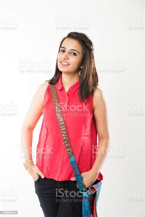 Indian Pretty College Girl Or Student Standing With Bag And Books