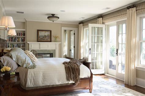 A master bedroom suite in a compact 1930s colonial revival home in suburban newton, ma, gets a makeover. Master bedroom with fireplace, bookshelf and French doors ...
