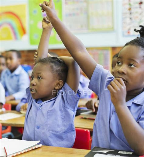 African American Students Raising Hands In Class — Childhood Answering