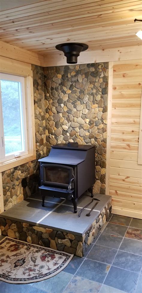 Building a slate tile wood stove hearth and live edge walnut mantle for our off grid cabin in the woods. Hand picked river stone over tile board woodstove hearth ...