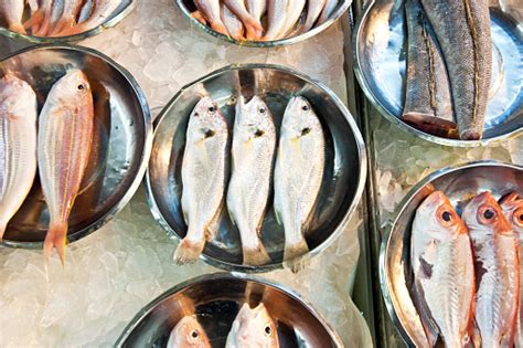 Whole Fresh Fishes Are Offered In The Fish Market In Asia Stock Photo